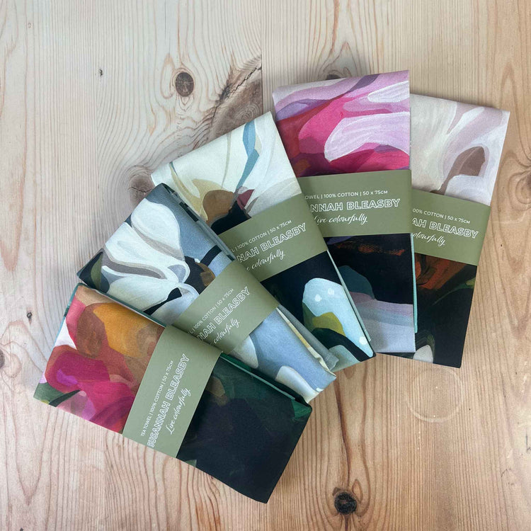 cotton tea towels fanned out on a table