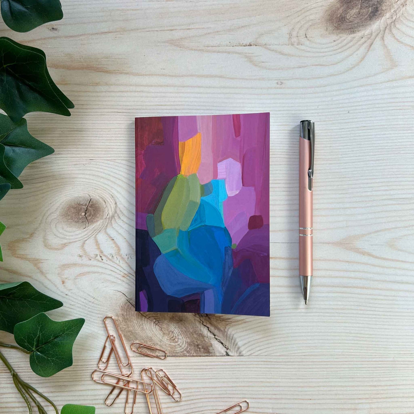 A6 softcover notebook with purple abstract cover design