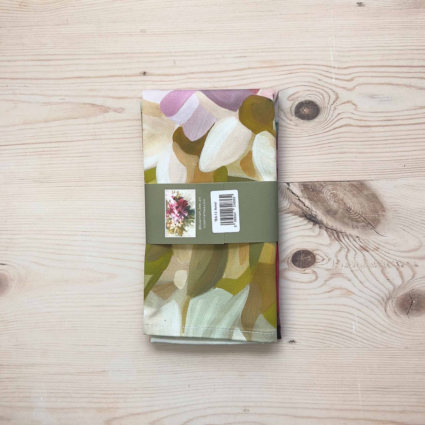 british cotton tea towel folded with a bellyband