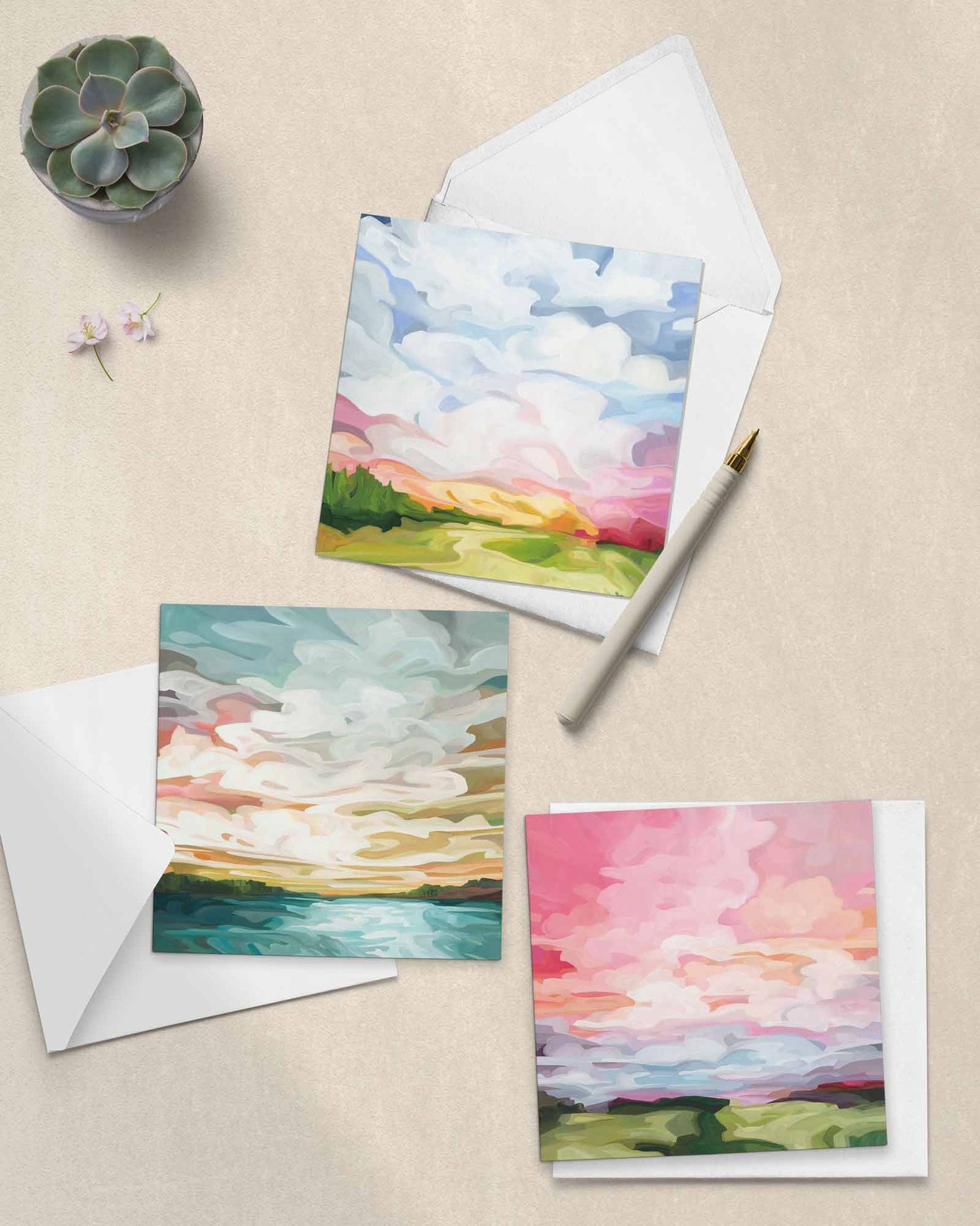 three colourful art greeting cards with paintings of abstract skies