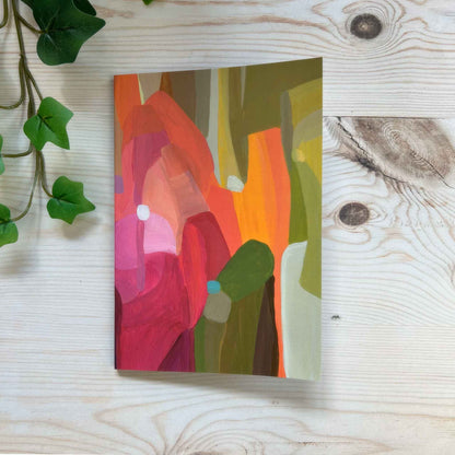 A5 softcover notebook with green and orange abstract cover design