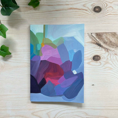 A5 softcover notebook with periwinkle blue abstract cover design