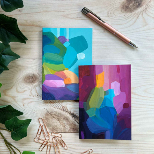 A6 notebooks with blue and purple abstract art covers