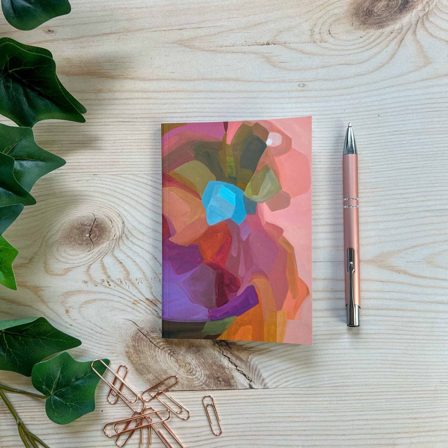 Peach A6 notebook with abstract cover design