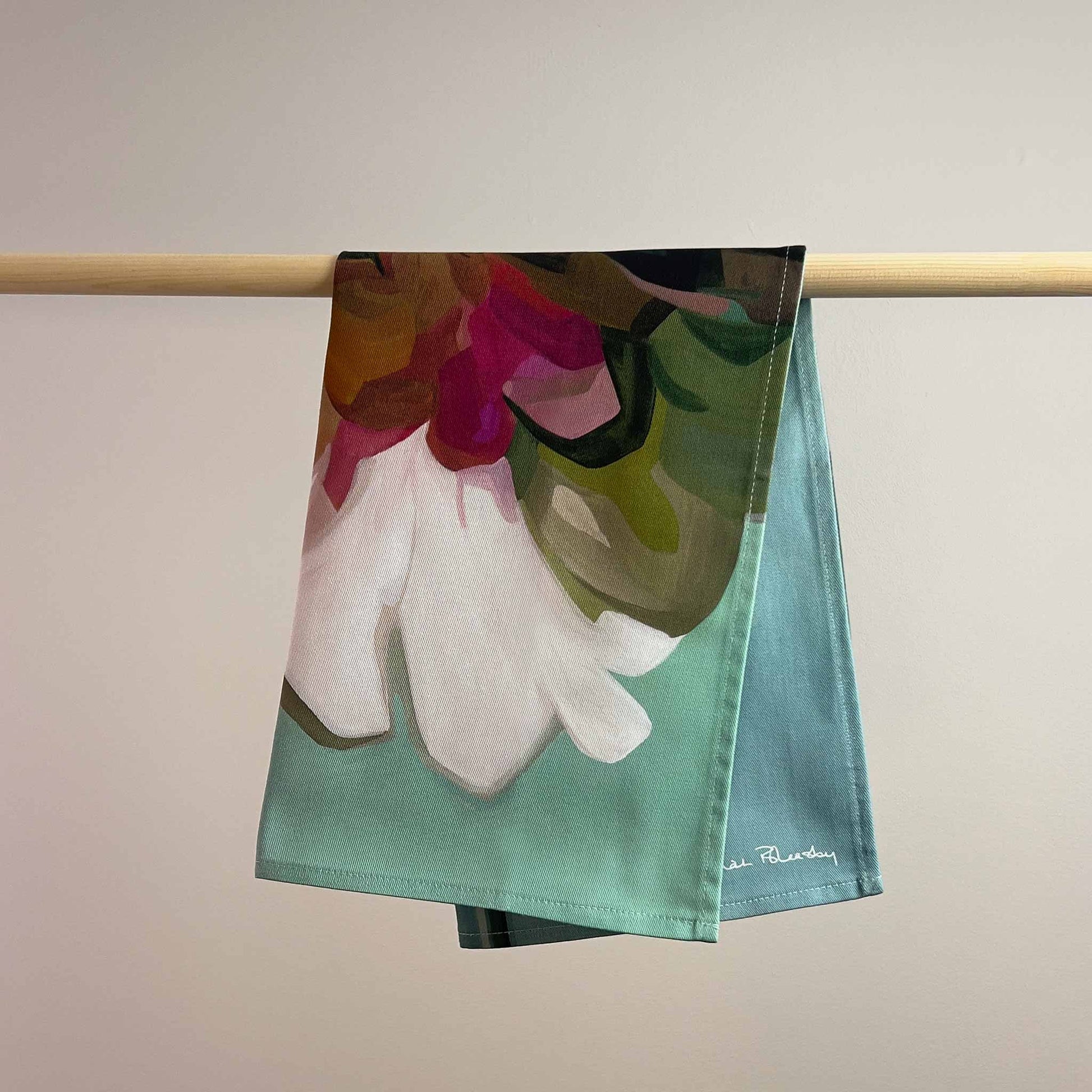 teal cotton tea towel with white abstract floral design