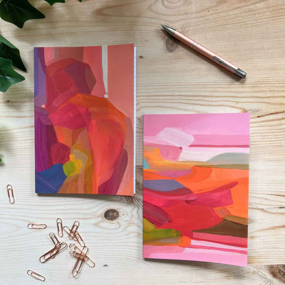 set of A5 notebooks with magenta and pink abstract cover designs