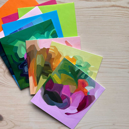 mauve abstract art card uk on a stack of colourful cards