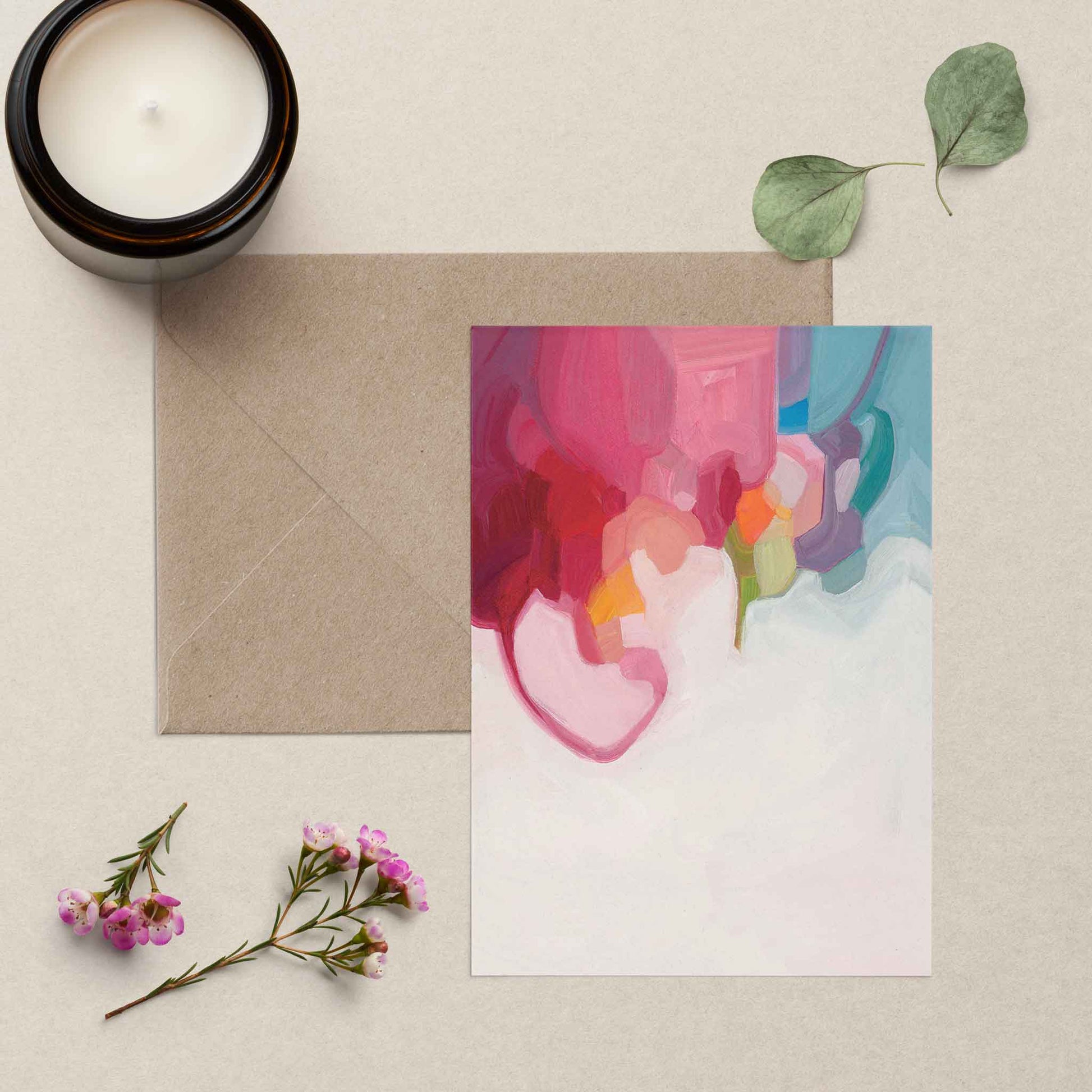 blank greeting card with abstract rainbow artwork and kraft envelope